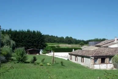 side of cottage, part of garden and edge of pool