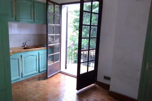 Kitchen showing steps to back garden