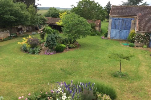 Part of the garden showing out buildings and barn from house