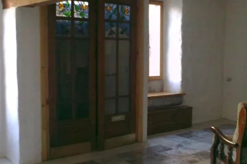 Sitting Room showing doors (can store bikes or wood behind)