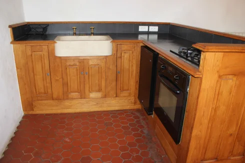 It's fully equipped with stone sink, brass taps, fridge, gas oven and hob