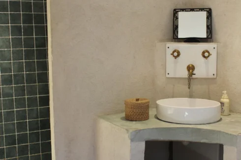 The 'en-suite' (power) shower room with WC & bespoke basin and solid brass taps.