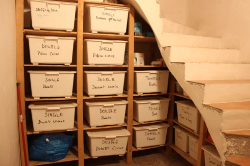 At the base of the second 'concealed' staircase is the stock room for the linen