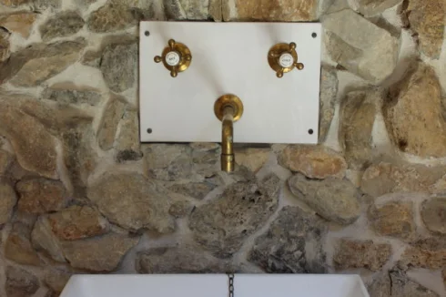 Bespoke hand basin and wall plate made and signed by the master potter who has a shop next door.