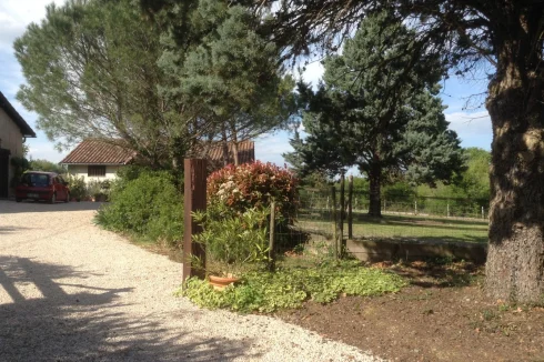 Drive to house from road showing stable block