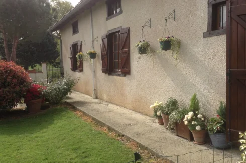 Back of house with gate to courtyard and stable block