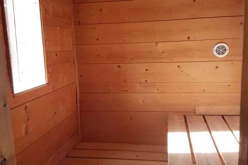 pool house sauna with view of sun set