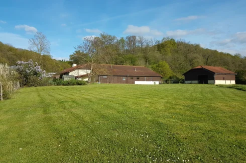 view from west over paddock to house and pool house