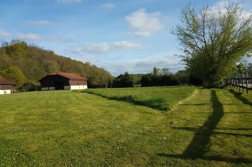 view south over paddock to pool house