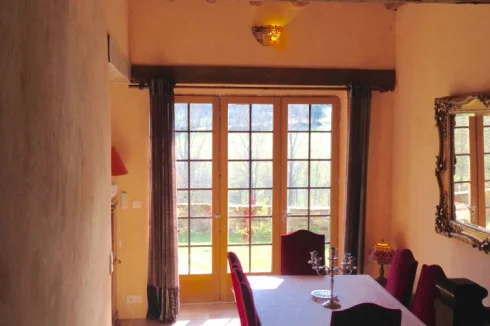 Looking down onto formal dining area from large hallway