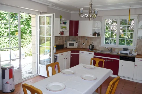 kitchen with open door to front garden