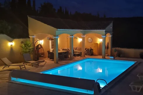 Pool and pool house at night