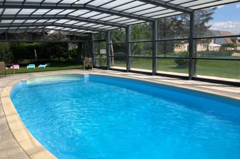 The heated and covered swimming pool