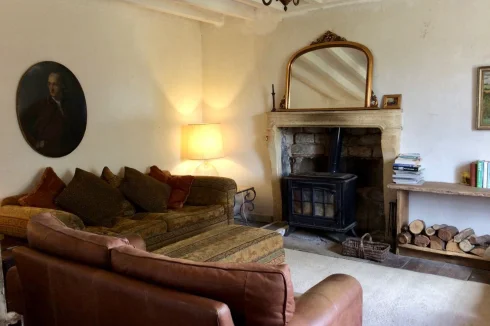 Big, square sitting room with stove