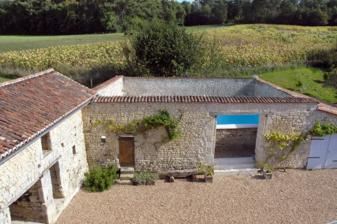 Gite on left and pool in barn