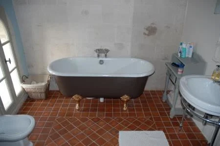 En-suite bathroom with power shower and antique roll top bath