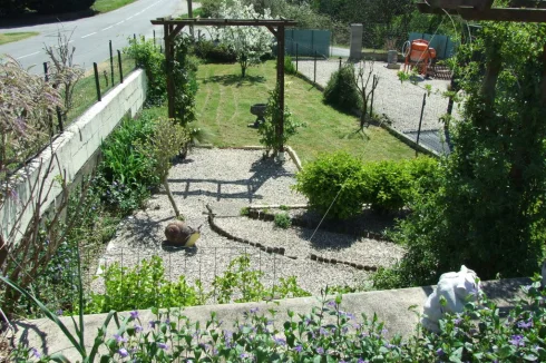 The 'Long Garden' in spring. All gardens have taps, mature shrubs, low maintenance.