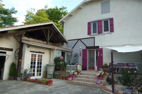 House from courtyard. Garage, potting shed on this level. Gite below, house above