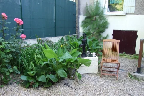 Shaded back garden - access from dining room. Evening sun, low maintenance