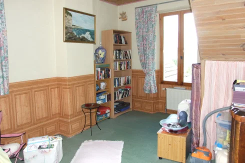 4 of 4 double bedrooms. Currently playroom/library. Stairs to attic