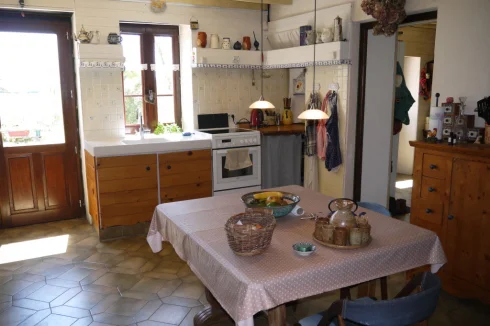 Kitchen with door to guestroom