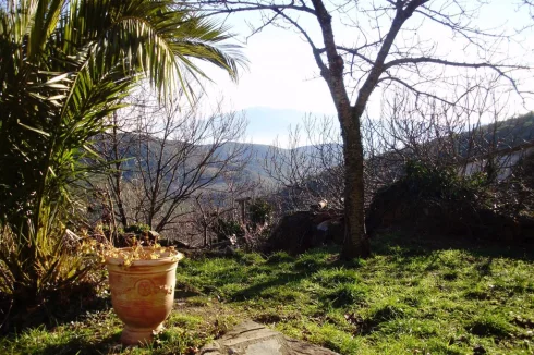 garden view with ceret in the valley and a glimpse of the sea to the east