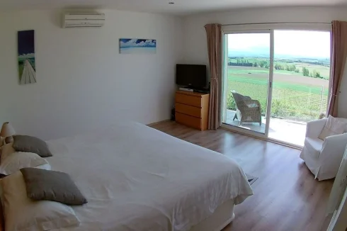 Main Bedroom - patio doors to glass panelled balcony