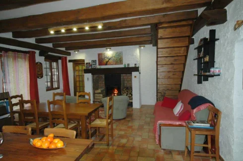 Open living room w/cast iron fireplace insert