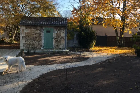 Garden with the small stone barn