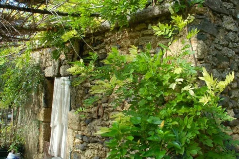 The stone house in the prairie with adjacent source