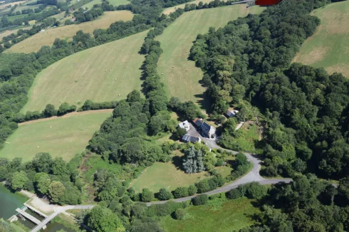 Aerial view of property and land