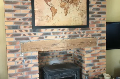 The brick fireplace in the salon is lovely and cosy