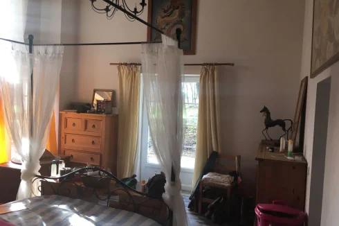 Master bedroom with French windows, en-suite, vaulted ceilings, original beams and private mezzanine